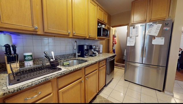 2547 Laconia Ave, Bronx, NY 10469 - kitchen featuring stainless steel appliances, a sink, tasteful backsplash, and light stone counters