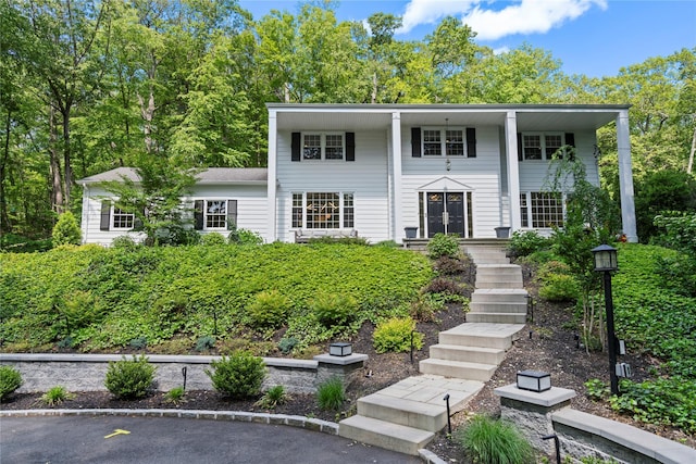 1508 Laurel Hollow Rd, Laurel Hollow, NY 11791 - greek revival inspired property featuring covered porch and stairway