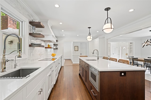 1508 Laurel Hollow Rd, Laurel Hollow, NY 11791 - kitchen featuring stainless steel microwave, open shelves, light countertops, recessed lighting, and backsplash