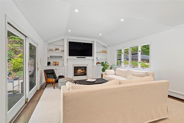 1508 Laurel Hollow Rd, Laurel Hollow, NY 11791 - living room with lofted ceiling, a glass covered fireplace, built in features, wood finished floors, and a baseboard radiator