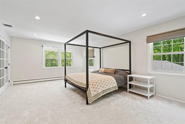 1508 Laurel Hollow Rd, Laurel Hollow, NY 11791 - carpeted bedroom with a baseboard radiator, multiple windows, and recessed lighting