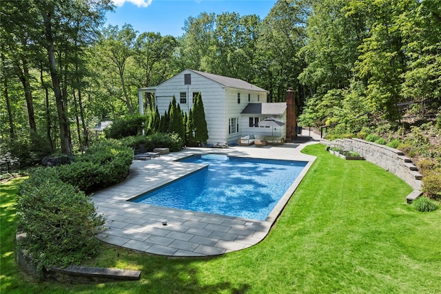 1508 Laurel Hollow Rd, Laurel Hollow, NY 11791 - back of house with a patio, a lawn, and an outdoor pool