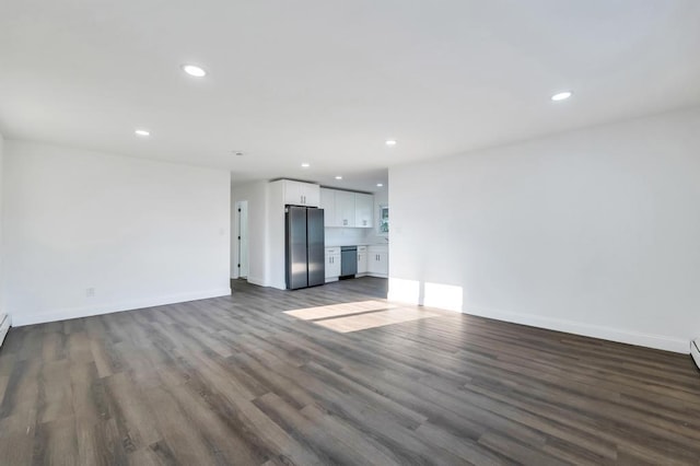 7 Argyle Dr, Shirley, NY 11967 - unfurnished living room featuring recessed lighting and dark wood-type flooring