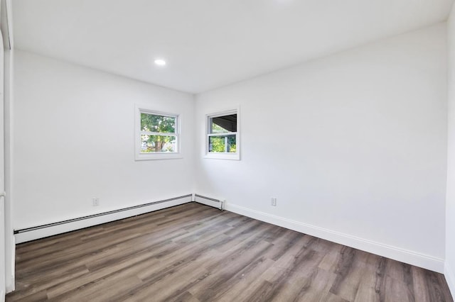7 Argyle Dr, Shirley, NY 11967 - unfurnished room with a baseboard radiator, wood finished floors, and recessed lighting