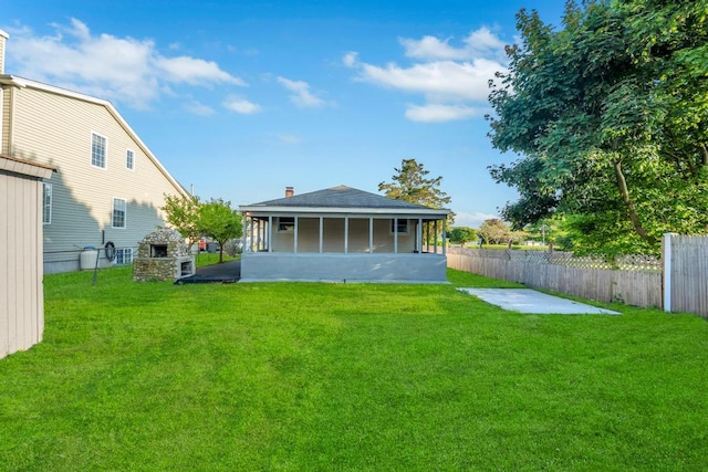 7 Argyle Dr, Shirley, NY 11967 - back of property with a sunroom, a patio area, roof with shingles, and a chimney