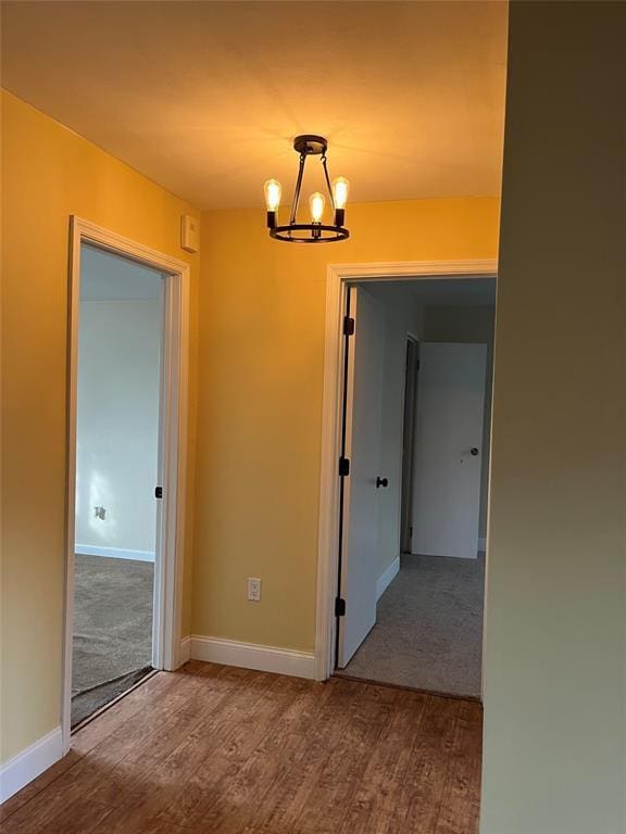 1548 Rte 9 Unit 1B, Wappingers Falls, NY 12590 - unfurnished room with a chandelier, wood finished floors, and baseboards