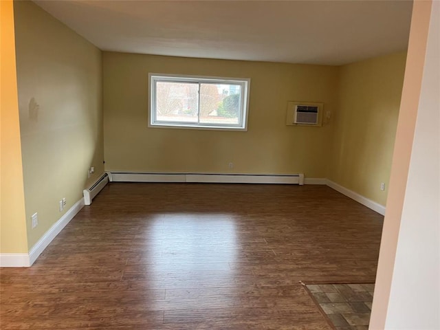 1548 Rte 9 Unit 1B, Wappingers Falls, NY 12590 - empty room with wood finished floors, a baseboard radiator, a wall unit AC, and baseboards