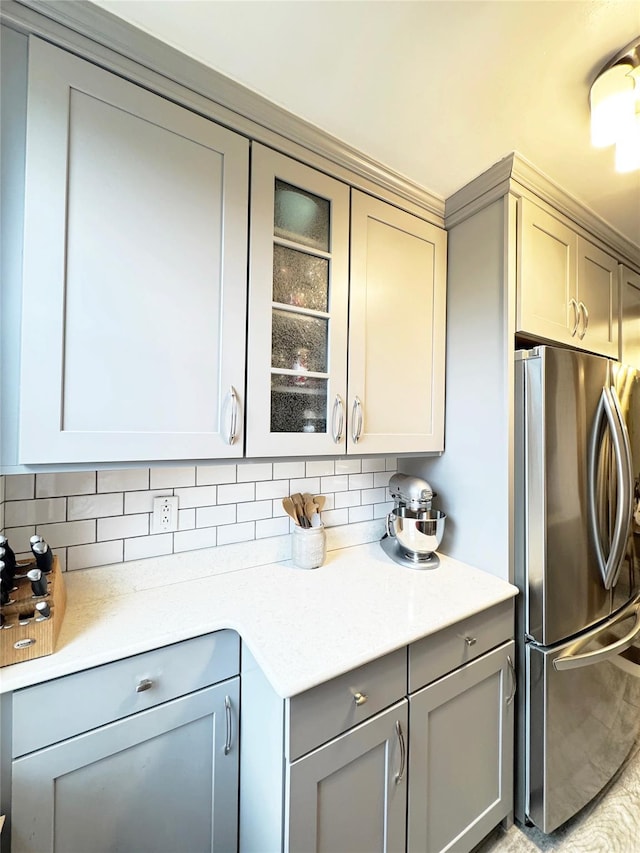 1475 Thieriot Ave Unit 6E, Bronx, NY 10460 - kitchen with freestanding refrigerator, gray cabinets, backsplash, and glass insert cabinets
