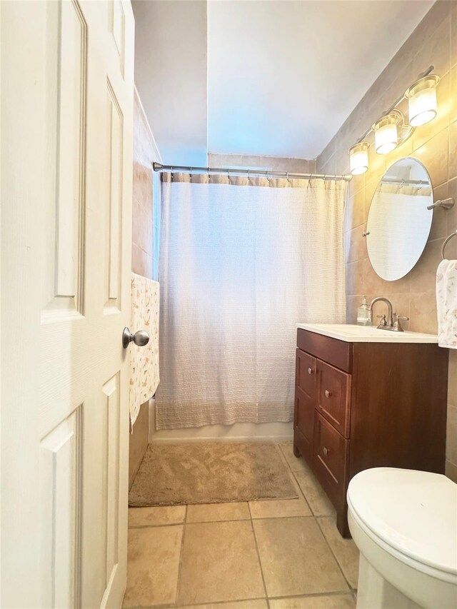 1475 Thieriot Ave Unit 6E, Bronx, NY 10460 - full bathroom featuring vanity, shower / bath combo, toilet, tile patterned floors, and tile walls