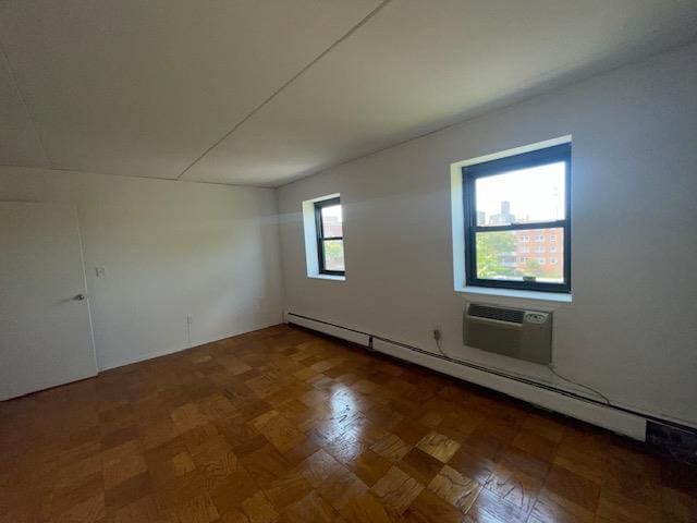 100 Clinton Ave Unit 4T, Mineola, NY 11501 - empty room with a baseboard radiator