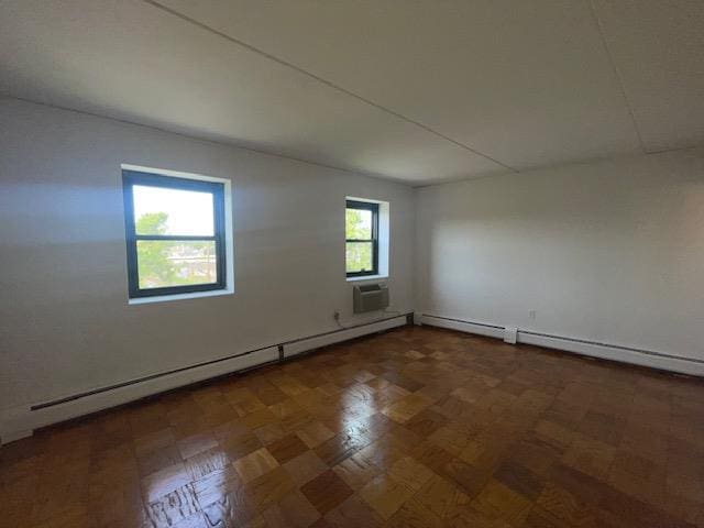 100 Clinton Ave Unit 4T, Mineola, NY 11501 - spare room featuring a baseboard radiator