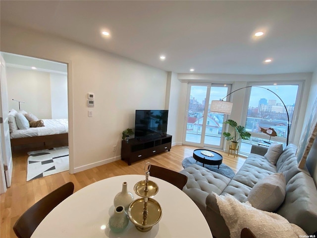 4223 Parsons Blvd Unit 1E, Flushing, NY 11355 - living room featuring light wood-type flooring, recessed lighting, and baseboards