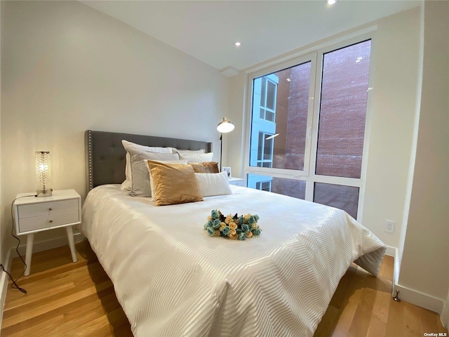 4223 Parsons Blvd Unit 1E, Flushing, NY 11355 - bedroom featuring light wood-style floors, baseboards, recessed lighting, and lofted ceiling