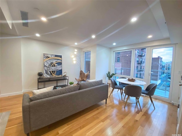 4223 Parsons Blvd Unit 1E, Flushing, NY 11355 - living room featuring light wood-style floors, baseboards, and recessed lighting