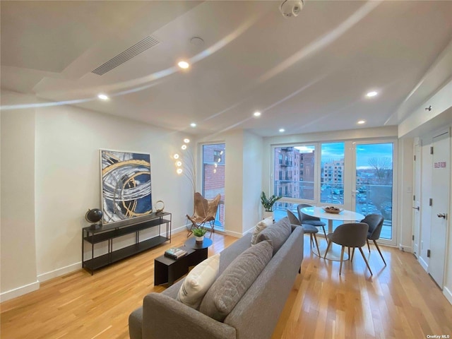 4223 Parsons Blvd Unit 1E, Flushing, NY 11355 - living room featuring baseboards, light wood-style floors, and recessed lighting