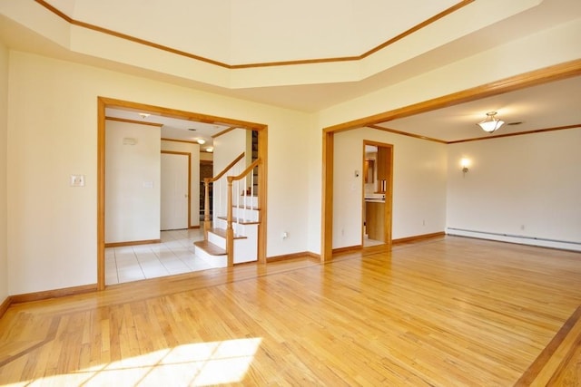 4 Andrew Ct, Florida, NY 10921 - spare room featuring a baseboard radiator, light wood-style floors, baseboards, stairway, and crown molding