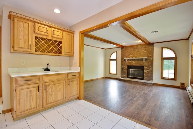 4 Andrew Ct, Florida, NY 10921 - kitchen with healthy amount of natural light, light countertops, light wood finished floors, baseboards, and beam ceiling