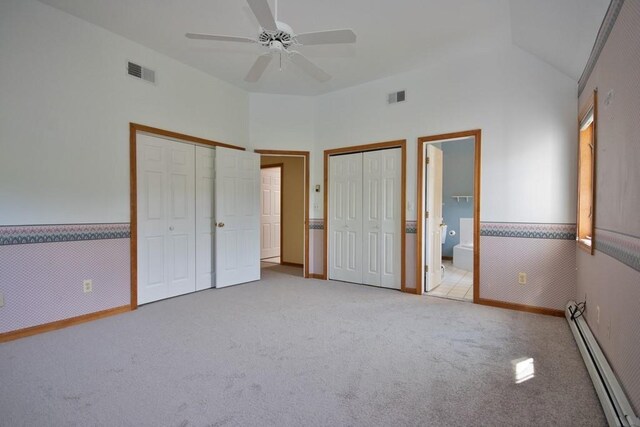4 Andrew Ct, Florida, NY 10921 - unfurnished bedroom with baseboard heating, carpet flooring, two closets, lofted ceiling, and baseboards