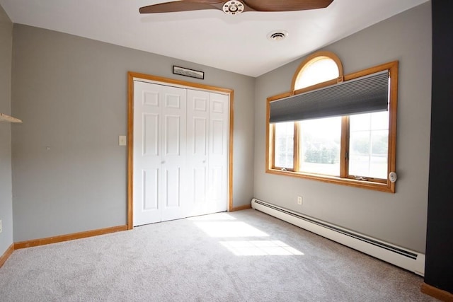 4 Andrew Ct, Florida, NY 10921 - unfurnished bedroom with baseboard heating, carpet, a closet, baseboards, and a ceiling fan
