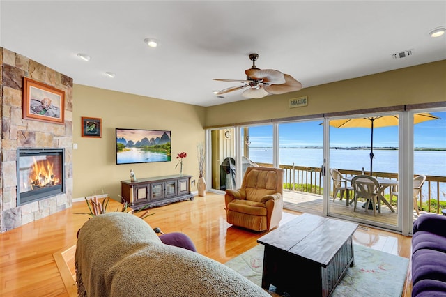 4 Waters Edge Unit 4, Shirley, NY 11967 - living area with a fireplace, ceiling fan, wood finished floors, and recessed lighting