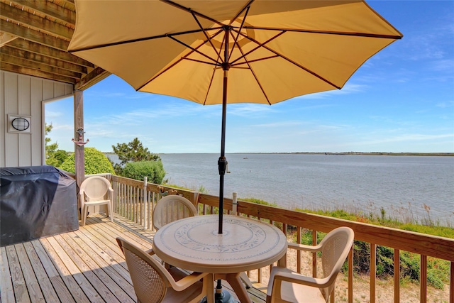4 Waters Edge Unit 4, Shirley, NY 11967 - wooden terrace featuring a water view, a grill, and outdoor dining space