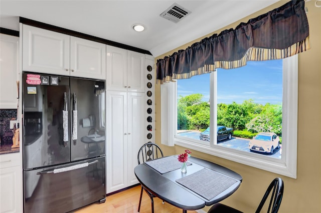 4 Waters Edge Unit 4, Shirley, NY 11967 - kitchen with freestanding refrigerator, white cabinets, light wood-type flooring, and recessed lighting