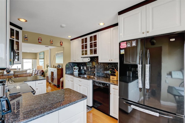 4 Waters Edge Unit 4, Shirley, NY 11967 - kitchen featuring freestanding refrigerator, dishwasher, white cabinets, glass insert cabinets, and light wood finished floors