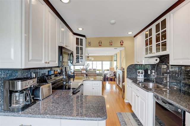 4 Waters Edge Unit 4, Shirley, NY 11967 - kitchen with black appliances, a sink, recessed lighting, glass insert cabinets, and light wood finished floors