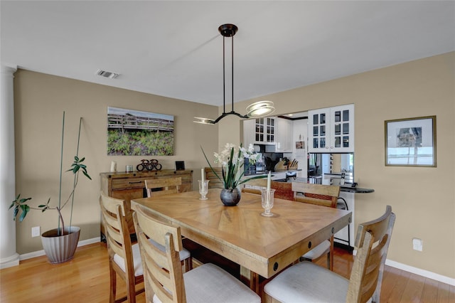 4 Waters Edge Unit 4, Shirley, NY 11967 - dining room featuring light wood-type flooring, baseboards, and plenty of natural light