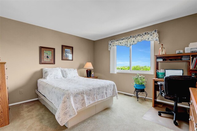 4 Waters Edge Unit 4, Shirley, NY 11967 - bedroom featuring carpet flooring, baseboards, and an office area