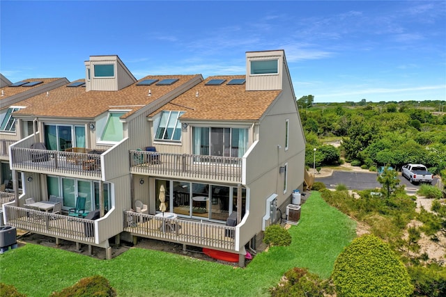 4 Waters Edge Unit 4, Shirley, NY 11967 - rear view of property with roof with shingles, central AC, a yard, and a balcony
