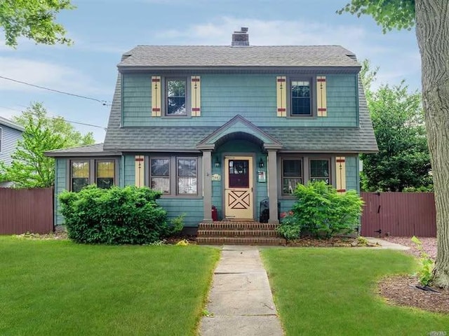 10 Central Pkwy, Merrick, NY 11566 - view of front of home with a chimney and roof with shingles
