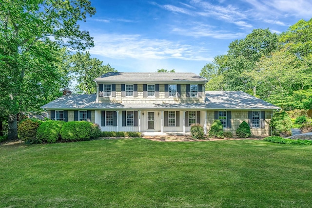 7 Sandpiper Ct, Shoreham, NY 11786 - colonial inspired home with a porch, a front yard, and a chimney