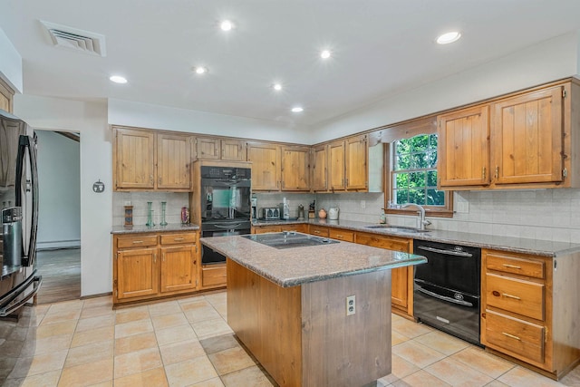 7 Sandpiper Ct, Shoreham, NY 11786 - kitchen featuring black appliances, a sink, a center island, tasteful backsplash, and light stone countertops