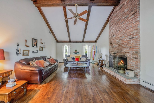 7 Sandpiper Ct, Shoreham, NY 11786 - living room with a baseboard radiator, beamed ceiling, wood finished floors, a ceiling fan, and a brick fireplace