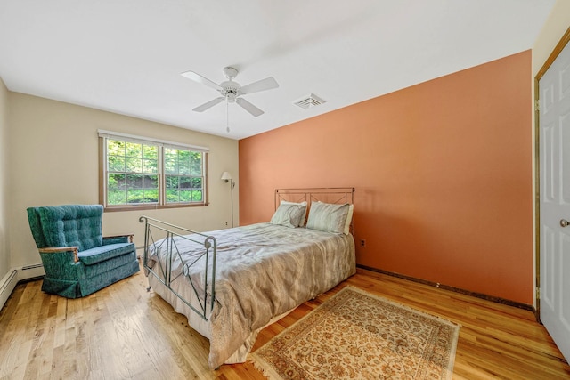 7 Sandpiper Ct, Shoreham, NY 11786 - bedroom with light wood finished floors, a ceiling fan, and baseboards