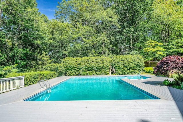7 Sandpiper Ct, Shoreham, NY 11786 - outdoor pool with a wooden deck