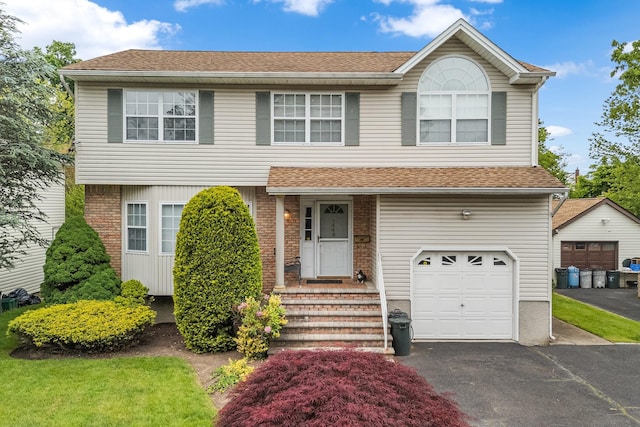 1448 Dewey Ave, North Bellmore, NY 11710 - view of front of home with a garage, driveway, and a shingled roof