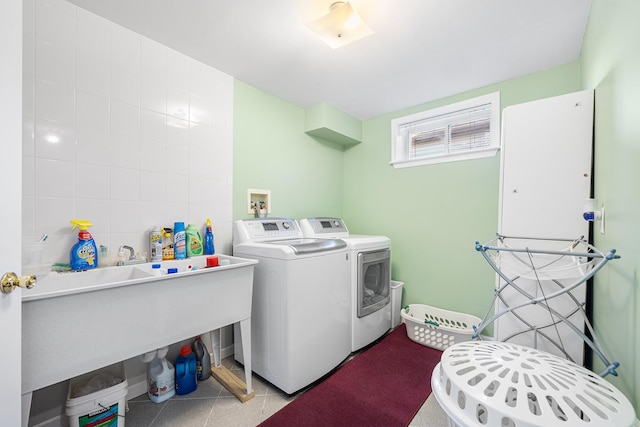 1448 Dewey Ave, North Bellmore, NY 11710 - laundry room with washing machine and clothes dryer and tile walls