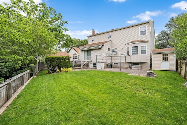 1448 Dewey Ave, North Bellmore, NY 11710 - back of house featuring a chimney, a patio area, entry steps, and an outbuilding
