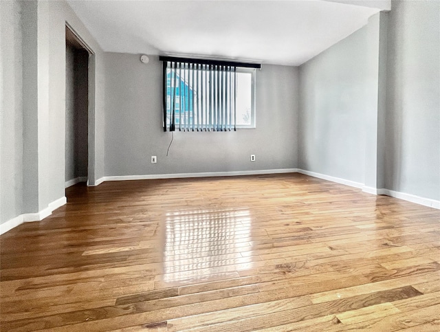 320 E 235th St, Bronx, NY 10470 - spare room featuring wood finished floors and baseboards