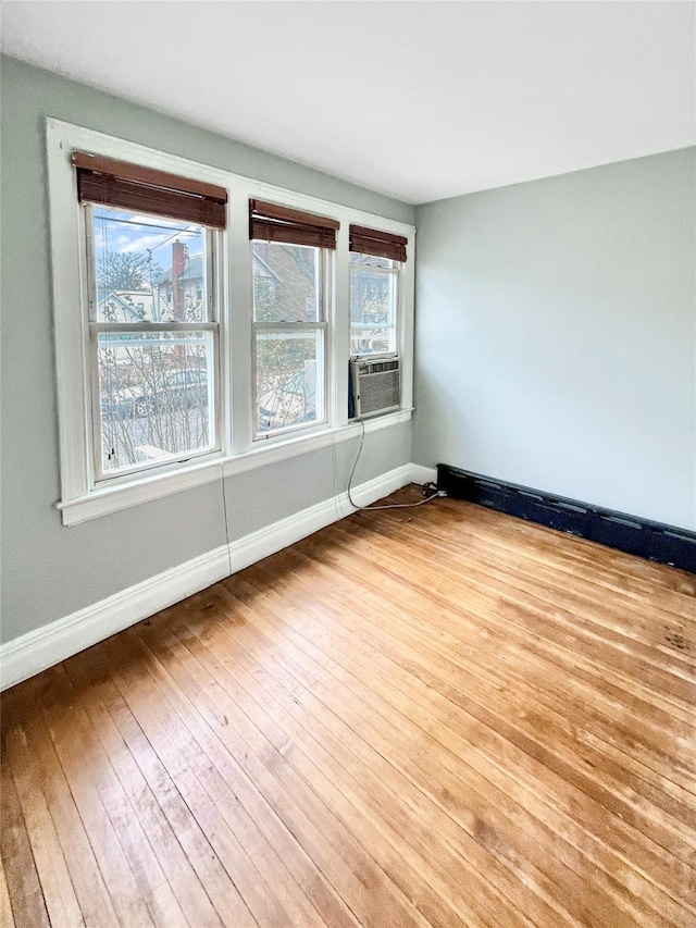 320 E 235th St, Bronx, NY 10470 - empty room with hardwood / wood-style flooring, baseboards, and plenty of natural light