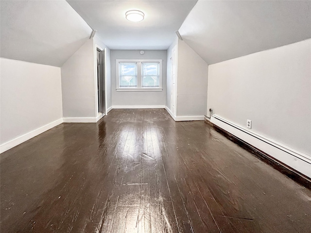 320 E 235th St, Bronx, NY 10470 - additional living space with a baseboard radiator, wood-type flooring, lofted ceiling, and baseboards