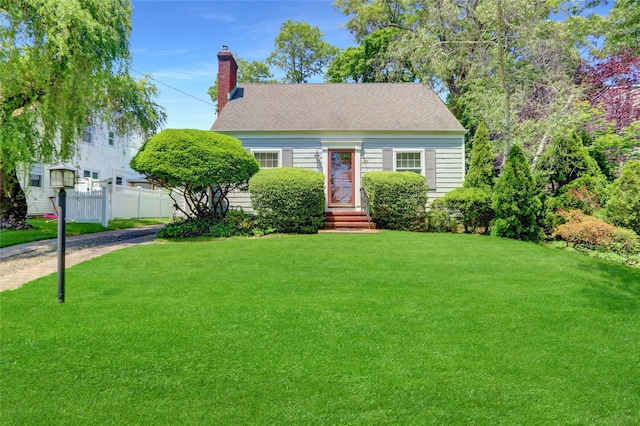 195 Loines Ave, Merrick, NY 11566 - view of front facade featuring a chimney and roof with shingles
