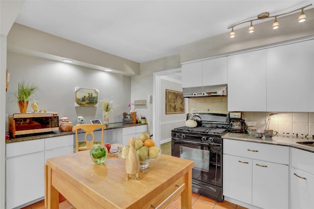 195 Loines Ave, Merrick, NY 11566 - kitchen featuring black gas range oven, wall chimney range hood, stainless steel microwave, tasteful backsplash, and white cabinetry