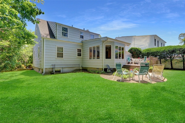 195 Loines Ave, Merrick, NY 11566 - rear view of property featuring a yard and a patio area