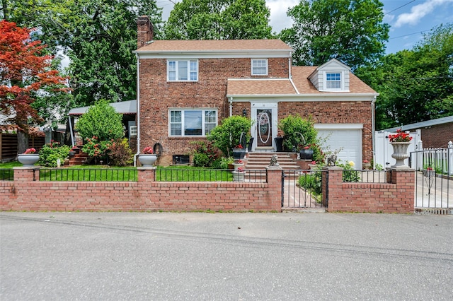 21AKA16 Larkspur Ln, Yonkers, NY 10704 - view of front of house featuring a fenced front yard, brick siding, a chimney, and a garage