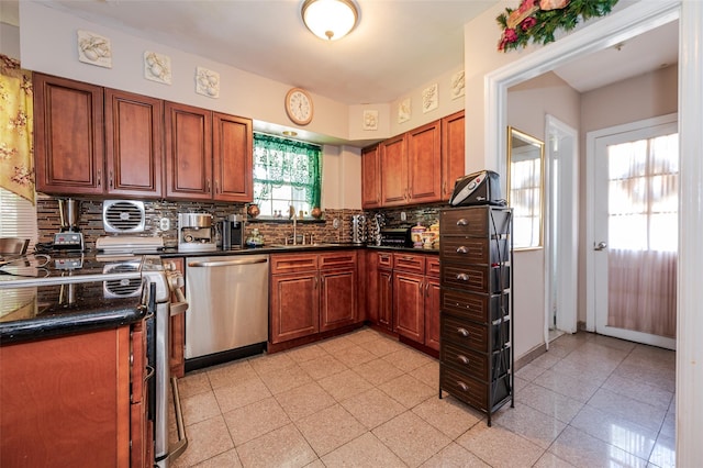 21AKA16 Larkspur Ln, Yonkers, NY 10704 - kitchen with stainless steel appliances, dark countertops, backsplash, a sink, and brown cabinetry