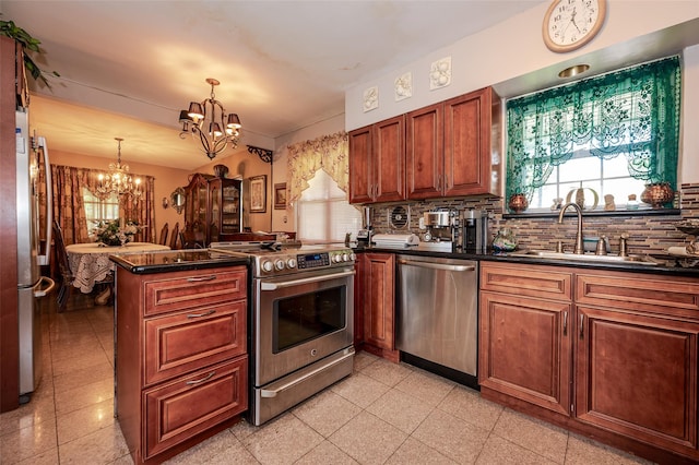 21AKA16 Larkspur Ln, Yonkers, NY 10704 - kitchen featuring appliances with stainless steel finishes, a chandelier, a sink, and dark countertops