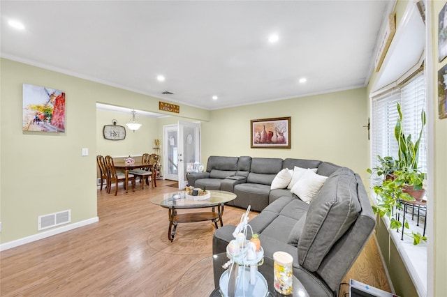 56 15th Ave, West Babylon, NY 11704 - living room featuring recessed lighting, crown molding, light wood-type flooring, and baseboards